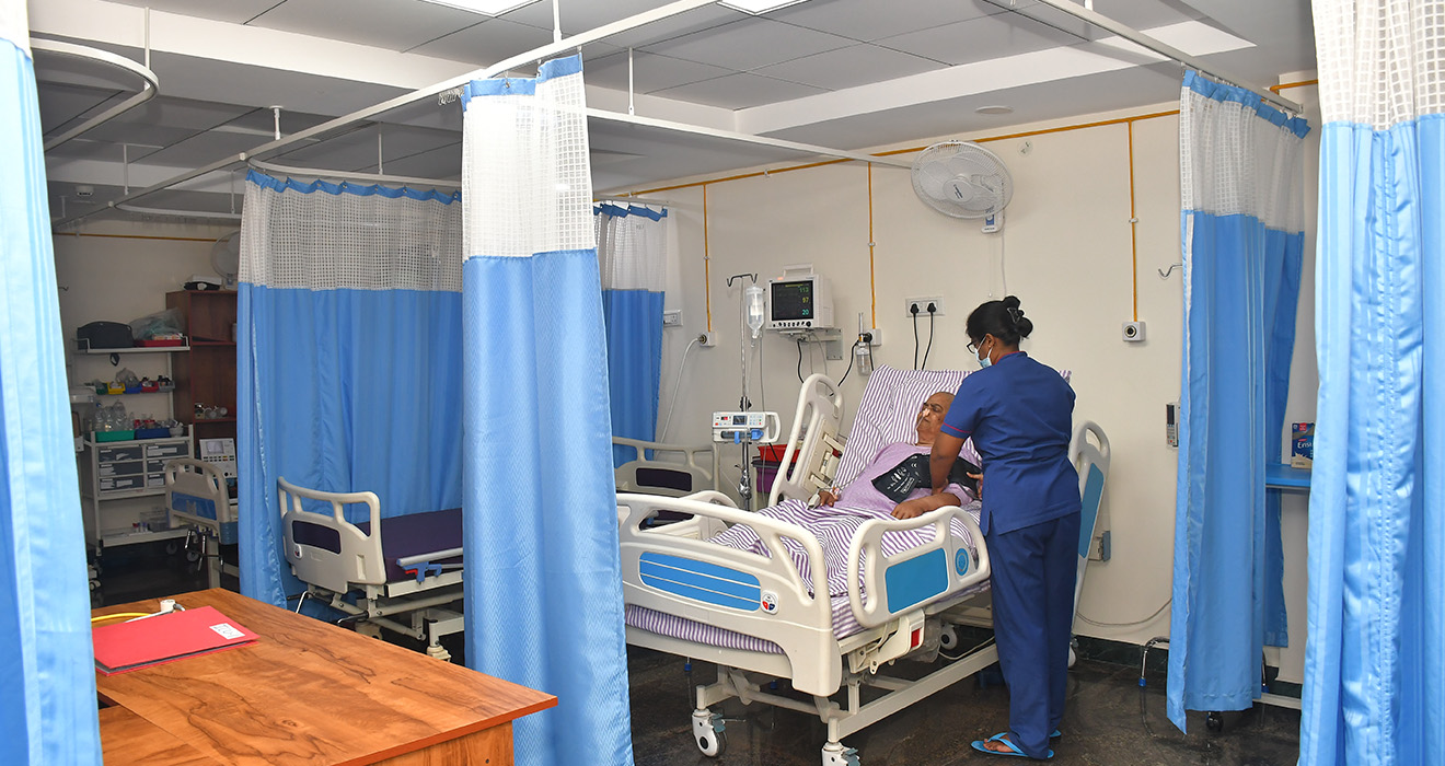 Cardiologist performing ECG test at cardiology department in Ayapakkam