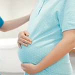 Mother holding newborn after normal delivery in Ayapakkam