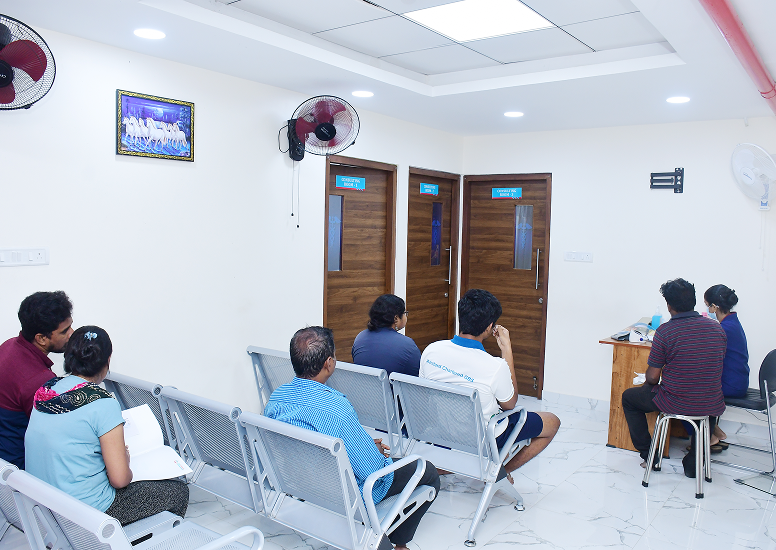 Patients seated in waiting area at Sri Ambal Healthcare Ayapakkam